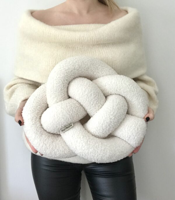 Image of a Boucle knot pillow in celtic knot shape